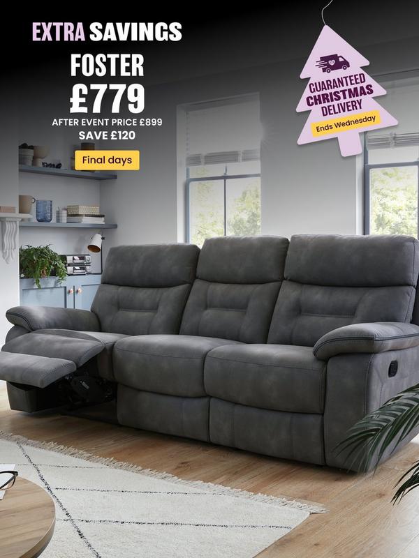 dark grey fabric recliner sofa next to fireplace