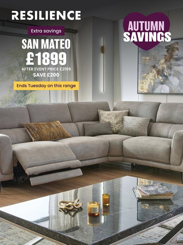 Stone coloured corner sofa with reclining features on footrest with selection of scatter cushions
