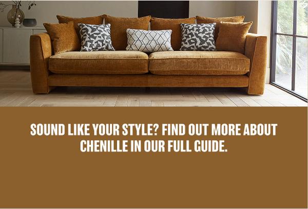 Burnt orange chenille sofa with black and white patterned scatter cushions against a large window