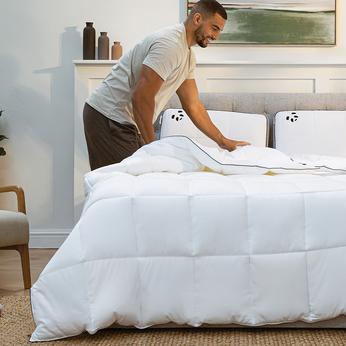 Person pulling on a duvet