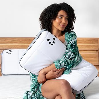 Person pulling on a duvet