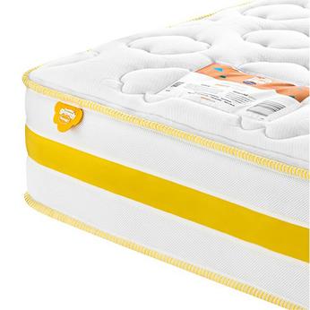 Side view of a yellow banded mattress on a white background