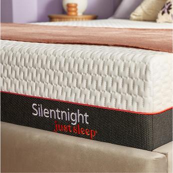 Side view of a mattress on a bed