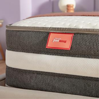 Side view of a mattress on a bed