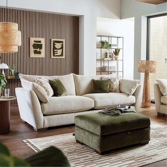 white sofa and a sage green footstool