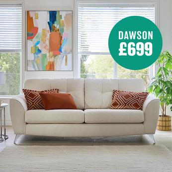 cream coloured sofa with dark orange scatter cushions