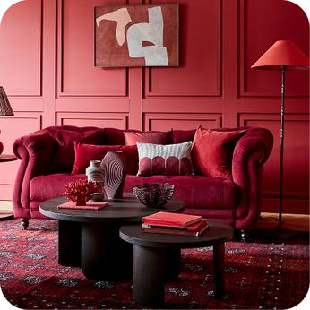red chesterfield sofa in a red room