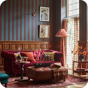red chesterfield sofa in a country house room