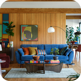 a retro-styled room with a bright blue sofa