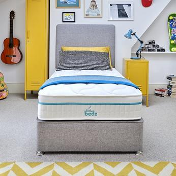 A mattress on a bed in a childs room