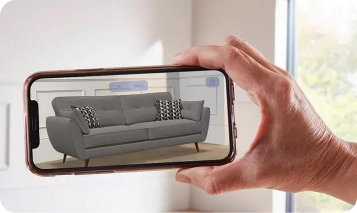 a grey sofa on a phone