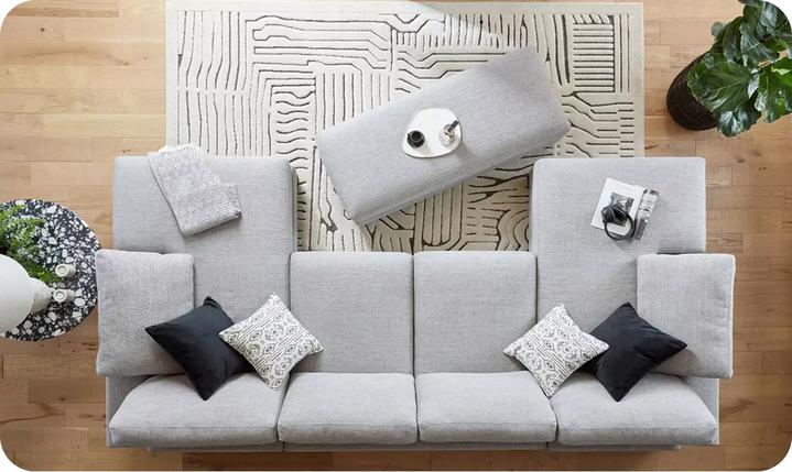 top down view of a grey u shaped sofa