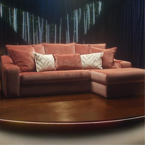 large red corner chaise sofa on tv stage