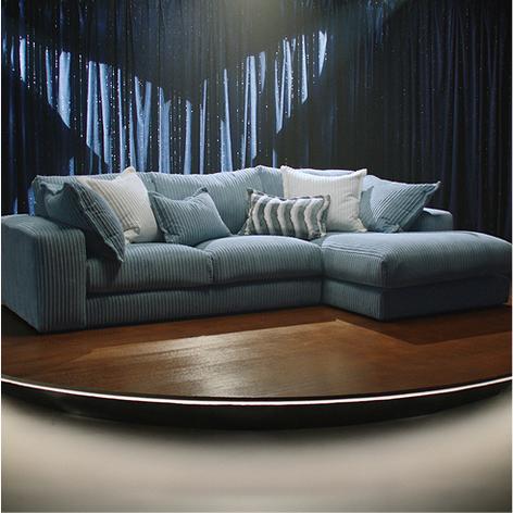 large blue corner chaise sofa on tv stage