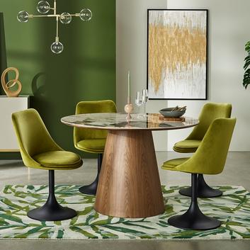 green dining chairs under a round dining table