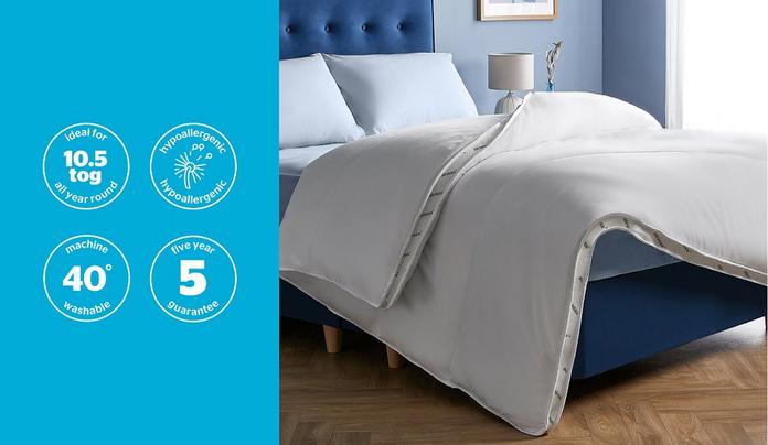 a duvet on a blue bedframe
