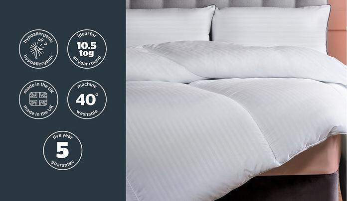 a duvet on a grey bedframe
