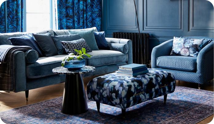 blue sofa and armchair in a blue living room