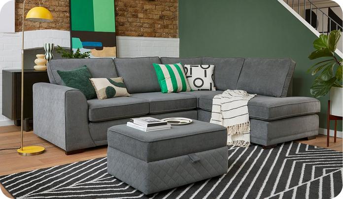 grey corner sofa with a grey footstool