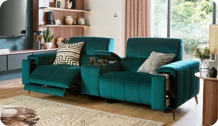 green recliner sofa with a centre console and storage in the arms