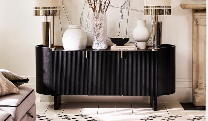 black sideboard with neutral ornaments