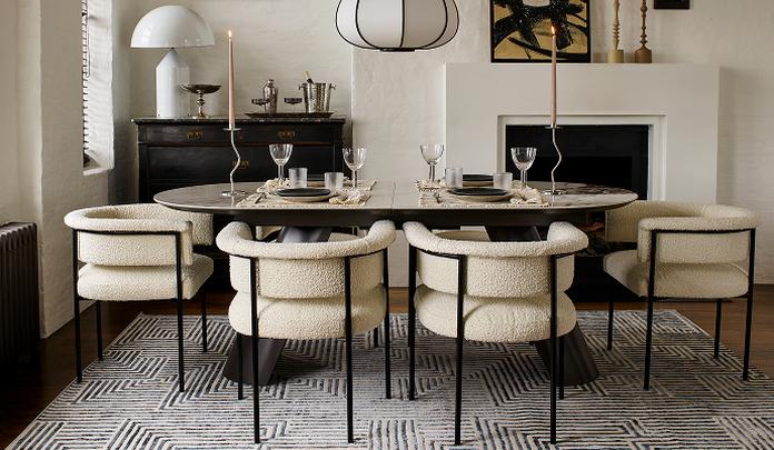 cream boucle dining chairs with a marble dining table