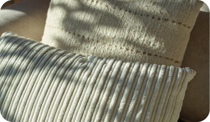 scatter cushions on a bed