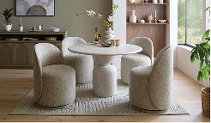 round marble dining with four grey boucle dining chairs