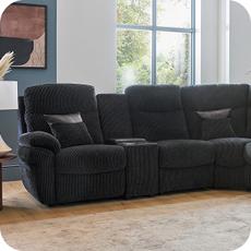black recliner sofa on a laminate floor