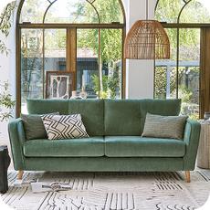 green sofa on a laminate floor
