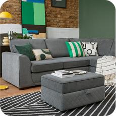grey corner sofa on a laminate floor