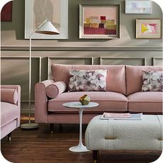 pink sofa on a laminate floor