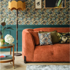 orange curved sofa and classic themed room