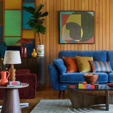 bright blue sofa and retro themed room