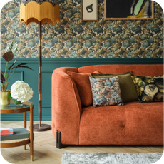orange curved sofa and classic themed room