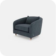 Navy blue patterned tub chair with scatter cushion