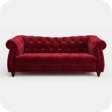 Red buttoned chesterfield sofa with scroll arms