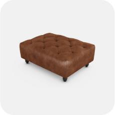 Brown leather buttoned footstool with black feet