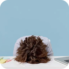 tired person asleep on the desk