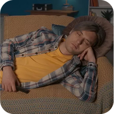 a person asleep on the sofa