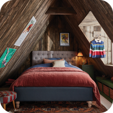 Blue bed frame in an attic room
