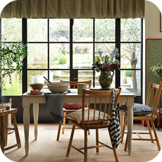 country style kitchen with wooden dining table and chairs