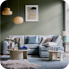 light blue corner sofa in a sun-drenched room