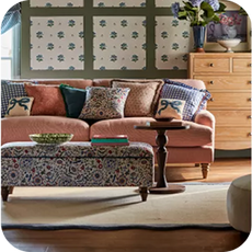 pink sofa in a cottage style setting