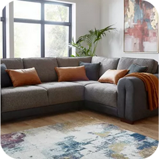 a large brown cushioned corner sofa