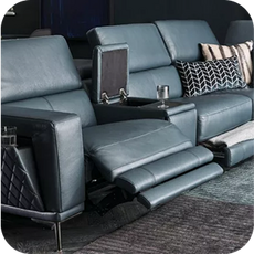 A large blue leather recliner sofa with an open storage compartment