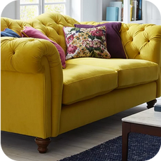 a bright yellow chesterfield sofa