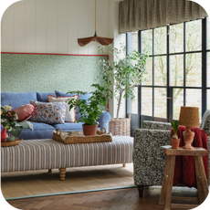 a blue sofa in a country house setting