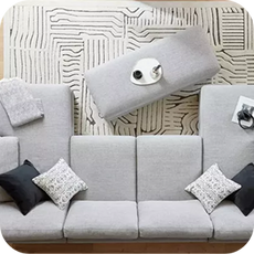 a top-down view of a grey U-shaped sofa