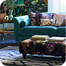 jade green sofa in a sun-drenched room